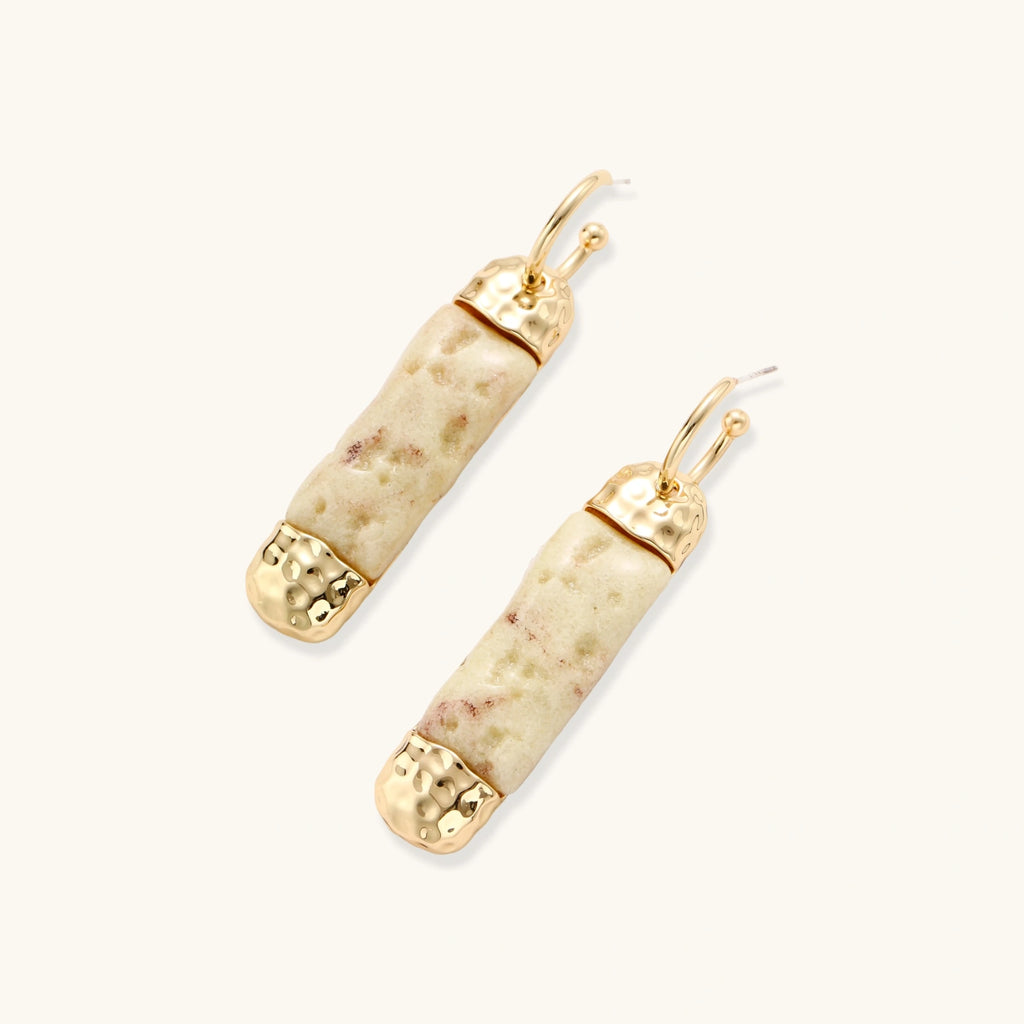 Cylindrical bar earrings featuring speckled natural resin center with polished metal caps and lever-back closures